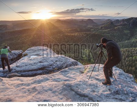 Photographer Prepare Camera To Takes Impressive Photos Of Misty Valley. Tourist Photographer At Shar