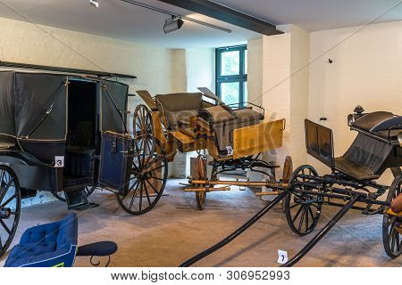 Bad Bentheim, Germany - June 9, 2019. Old, Antique Horse Carriages, Parked In The Castle Garage.