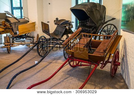 Bad Bentheim, Germany - June 9, 2019. Old, Antique Horse Carriages, Parked In The Castle Garage.