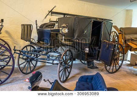 Bad Bentheim, Germany - June 9, 2019. Old, Antique Horse Carriages, Parked In The Castle Garage.