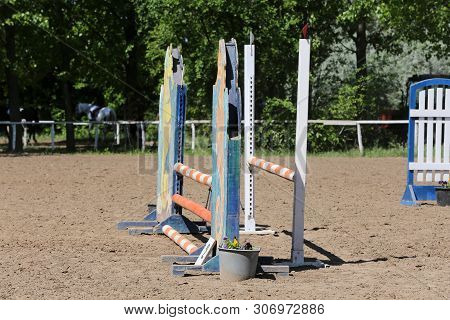 Image Of Show Jumping Poles On The Training Field. Wooden Barriers For Jumping Horses As A Backgroun