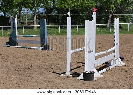 Image Of Show Jumping Poles On The Training Field. Wooden Barriers For Jumping Horses As A Backgroun