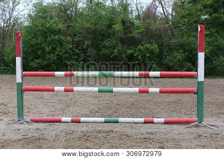 Image Of Show Jumping Poles On The Training Field. Wooden Barriers For Jumping Horses As A Backgroun