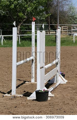Image Of Show Jumping Poles On The Training Field. Wooden Barriers For Jumping Horses As A Backgroun