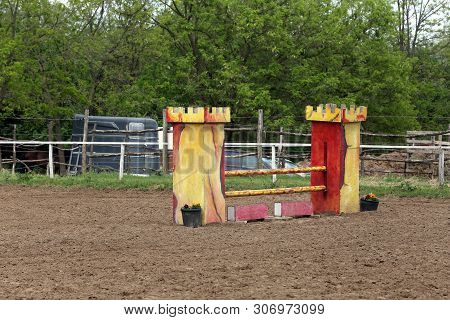 Image Of Show Jumping Poles On The Training Field. Wooden Barriers For Jumping Horses As A Backgroun