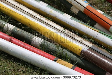 Image Of Show Jumping Poles On The Training Field. Wooden Barriers For Jumping Horses As A Backgroun