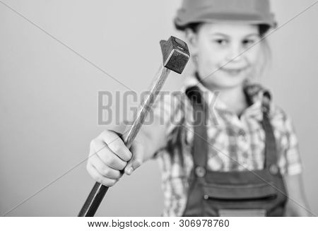 Hammer In Hand Of Small Girl Repairing In Workshop. Foreman Inspector. Little Girl In Helmet With Ha