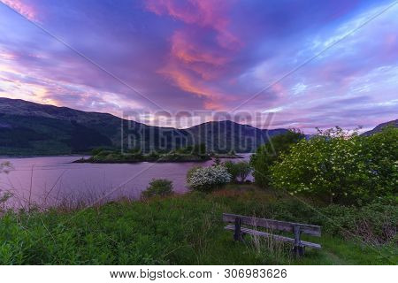 Eilean Munde Or The Burial Island Is A Small Island In Loch Leven In Twilight , Glencoe , Scotland