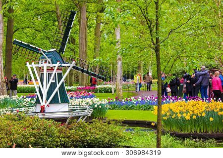 Keukenhof, Lisse, Netherlands - Apr 28th 2019: Famous Keukenhof Gardens With Windmill, Colorful Tuli