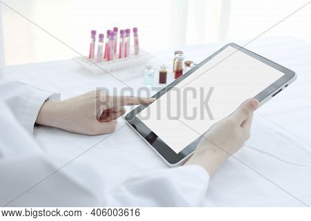Doctor Hands Use A Tablet,blank Screen Mockup, On The Work Table,working Doctor,white Office Of The 