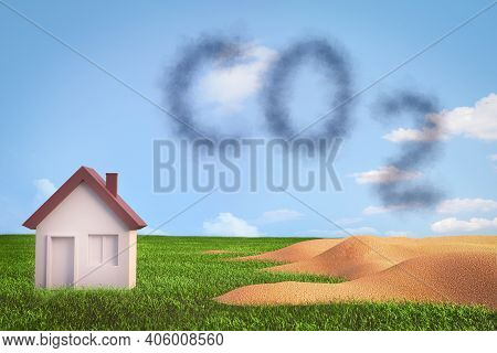 Carbon Dioxide And Greenhouse Effect Concept. Co2 Written In Smoke Letters Under A House In A Green 