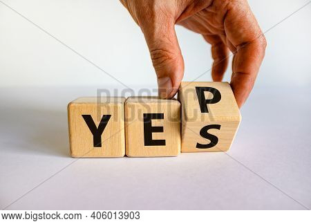 Yes Or Yep Symbol. Businessman Turns A Cube, Changes The Word 'yes' To 'yep'. Beautiful White Backgr