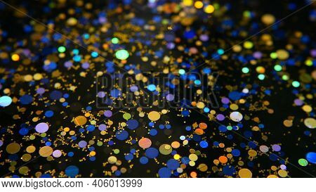 Defocused Shimmering Multicolored Glitter Confetti, Black Background. Holiday Abstract Festive Bokeh