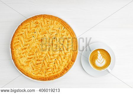 Homemade Gooseberry Lemon Pie And Cup Of Coffee Cappuccino On White Wooden Tabke. Top View.