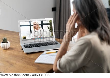 Video Conference With A Doctor, Video Consultation Online. A Female Doctor, Therapy Recommends Treat