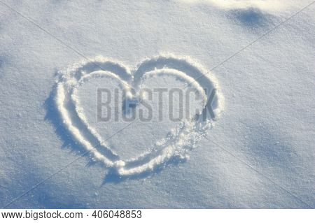 Heart In The Snow. Background For Decoration For The Holiday Of Valentine's Day. Cold Heart, Love. W