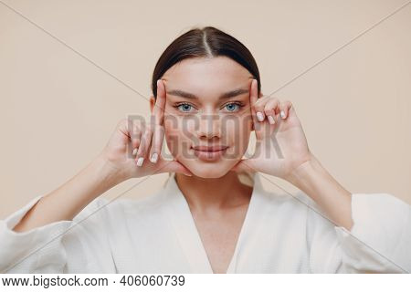 Young Woman Doing Face Building Facial Gymnastics Self Massage And Rejuvenating Exercises