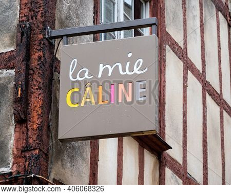 BAYONNE, FRANCE - CIRCA DECEMBER 2020: La Mie Caline sign. La Mie Caline is a French bakery chain. A few rain drops on the sign.