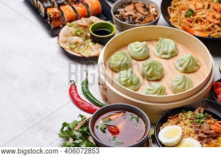 Assorted Of Different Asian Food. Chinese, Japanese And Thai Cuisine. Noodles, Dumplings Gedza, Baoz