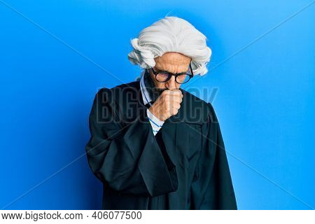 Middle age hispanic man wearing judge uniform feeling unwell and coughing as symptom for cold or bronchitis. health care concept. 