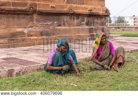 Aihole, Karnataka, India - November 7, 2013: Huchchimalli Gudi Or Temple. 2 Female Gardeners In Colo