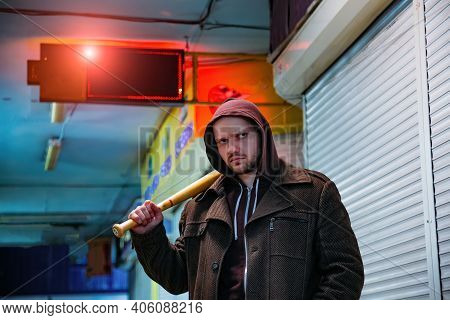 Street Hooligan With Wooden Bat In Subway