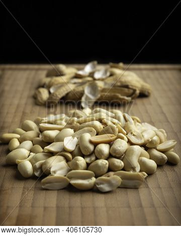 Close Up Of Peeled Peanuts Seeds On Bamboo Cutting Table. (arachis Hypogaea) Edible Seeds. Healthy S