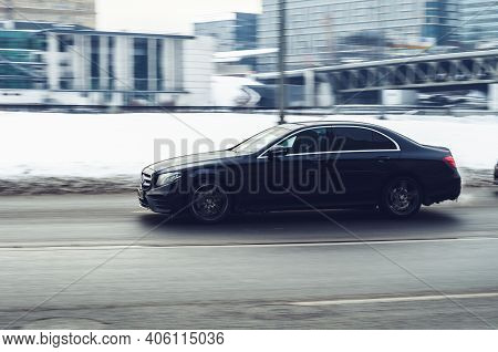 Moscow, Russia - January 15, 2021: Fast Moving Black Car With Motion Blur Effect. Overspeed Concept.