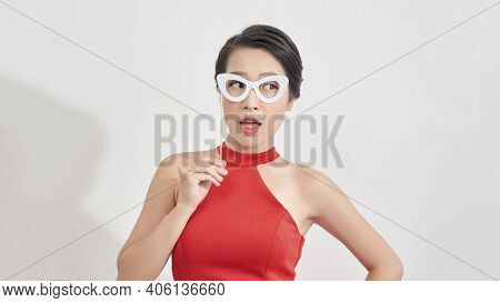 Portrait Of Good-looking Stylish Young Girl Attend Party With Face Mask Of Glasses On Stick, Smiling