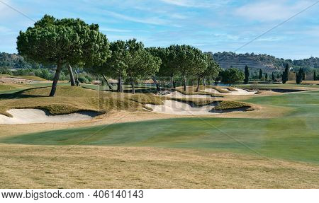 Picturesque Scenery Golf Course Green Field With Trees And Blue Lake During Warm Winter Sunny Day, M