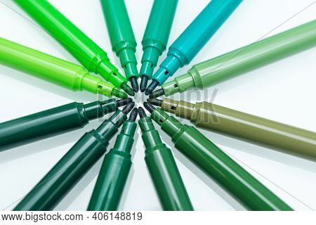 Close Up Of Green Colored Felt-tip Pens On Isolated Background. Selective Focus. Different Shades Of