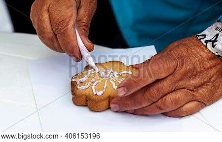 Perm Krai, Russia, July 2019. An Elderly Woman In A Blue Jacket With Her Left Hand Holds Cookies On 