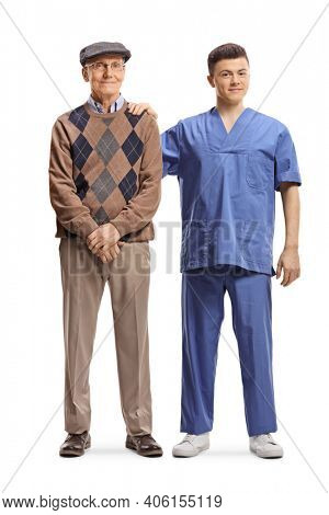 Full length portrait of a young male physioterapist standing next to an elderly man isolated on white background