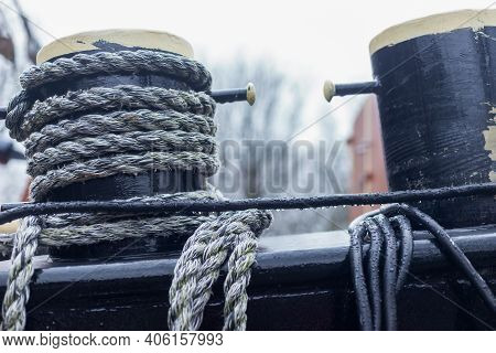 Traditional Dutch Boat And Equipment  In The Canal Near The City Gate Zijlpoort, Leiden, Netherlands