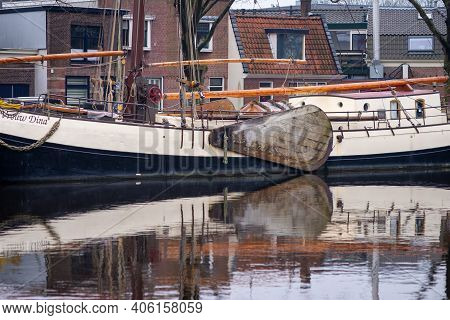 February 1, 2021, Leiden, Netherlands, Traditional Dutch Boat And Equipment  In The Canal Near The C