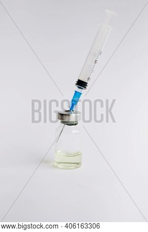 Vaccine. Syringe And Ampoule With A Vaccine. Coronavirus. Vaccination. Covid-19.
