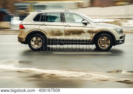 Moscow, Russia - January 29, 2021: Fast Moving Suv Rides On A Winter City Road. A Car On Wet Slipper