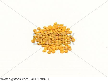 Pile Of Eggplant Or Aubergine Seeds In Plastic Container Isolated On White Background