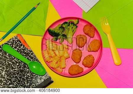 At Home Schooling Chicken Nugget Lunch Served On Tray With French Fries And Broccoli