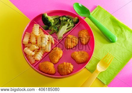 At Home Schooling Chicken Nugget Lunch Served On Tray With French Fries And Broccoli