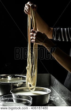 Cheesemaker Showing The Proceeding To Make Cheese From The Bio Milk. The Homemade Cheese Maker Produ