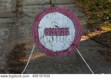 Old Cracked Shabby Road Sign Passage Closed. Brick Is A Road Sign That Blocks Passage On A Dangerous