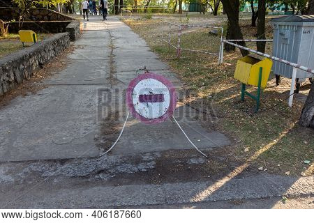 Old Cracked Shabby Road Sign Passage Closed. Brick Is A Road Sign That Blocks Passage On A Dangerous