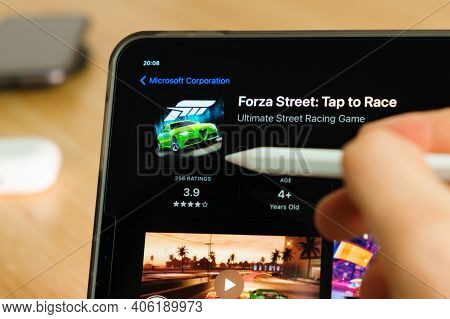 Forza Street Logo Shown By Apple Pencil On The Ipad Pro Tablet Screen. Man Using Application On The 