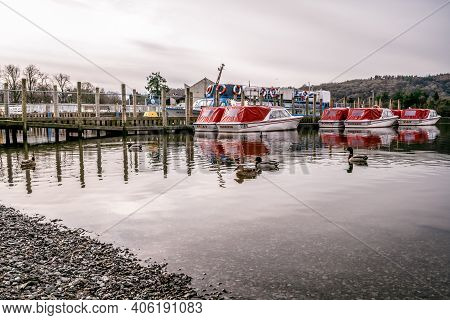 Bowness On Windermere, Cumbria, Uk - February 01, 2021: Tourist Pleasure Boats On Bowness Bay Lake W