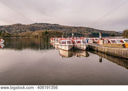 Bowness On Windermere, Cumbria, Uk - February 01, 2021: Tourist Pleasure Boats On Bowness Bay Lake W
