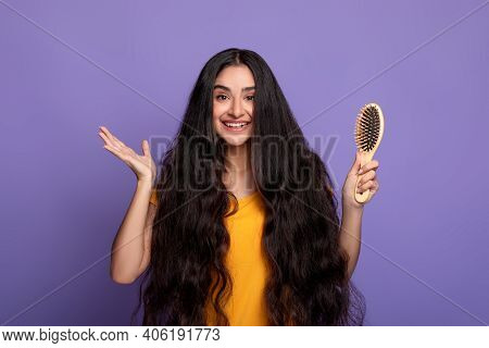 Hair Care And Beauty Concept. Portrait Of Positive Beautiful Young Indian Woman With Natural Dark Lo