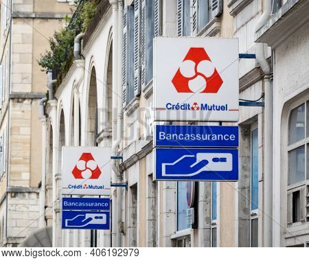 BAYONNE, FRANCE - CIRCA DECEMBER 2020: Credit Mutuel sign outside bank agency.