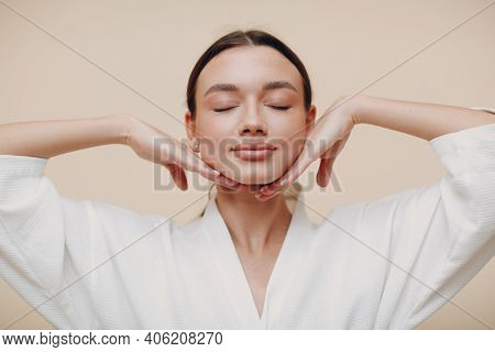 Young Woman Doing Face Building Yoga Facial Gymnastics Self Massage And Rejuvenating Exercises