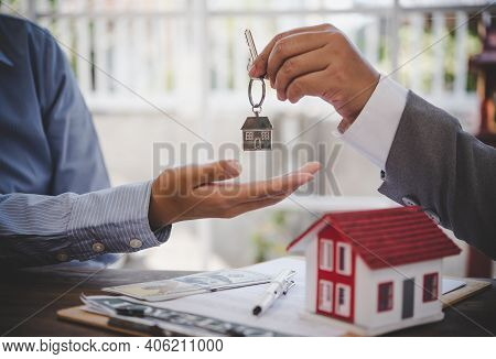 House Signers Signing Signature Loan Document To Home Ownership With Real Estate Agents Ownership. M